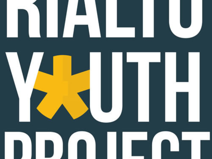 A dark grey/blue background with white capital letters reading ' Rialto youth project', the O in youth is replaced with a yellow asterisk.