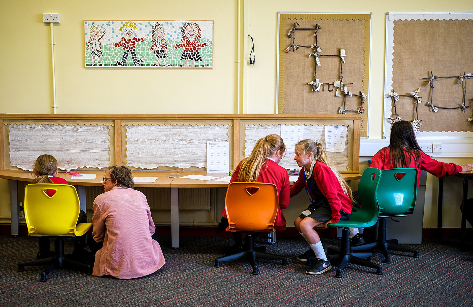 Andy with kids in a classroom.