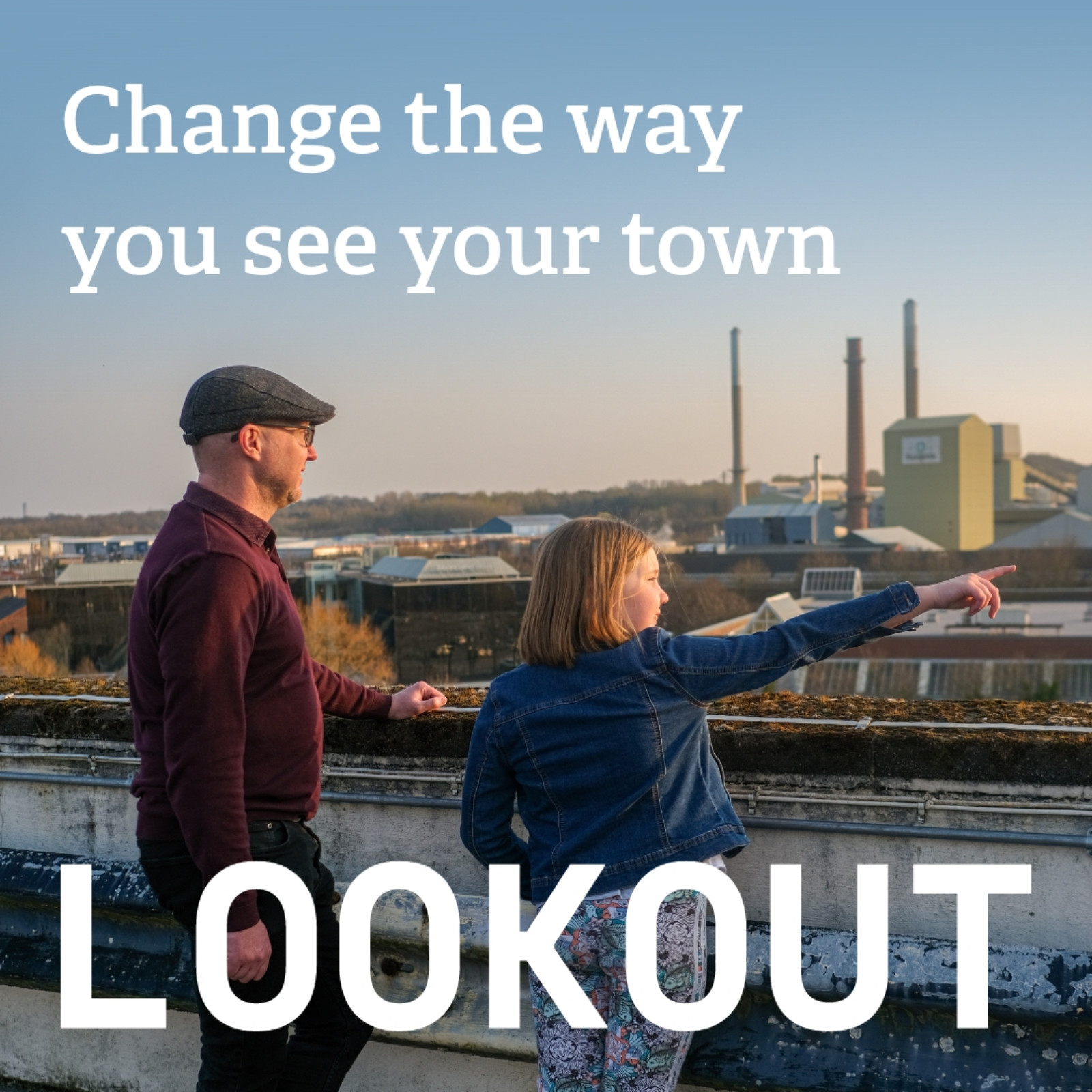 Two people looking over St Helens, with text that reads 'Change the way you see your town, LOOKOUT'.
