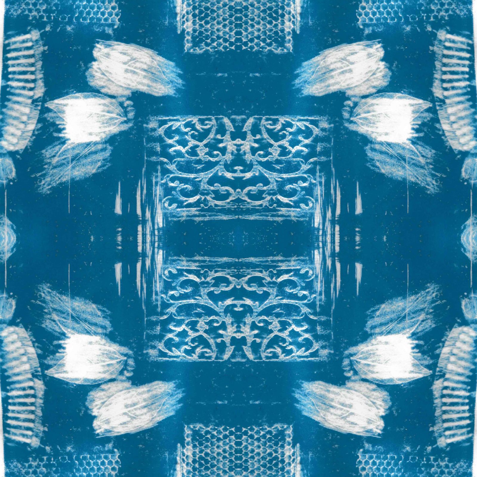 A square blanket decorated with an inky blue design