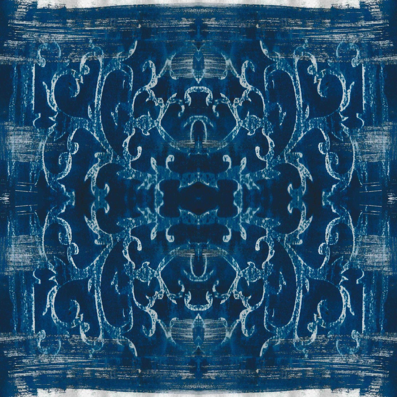 A square blanket decorated with an inky blue design