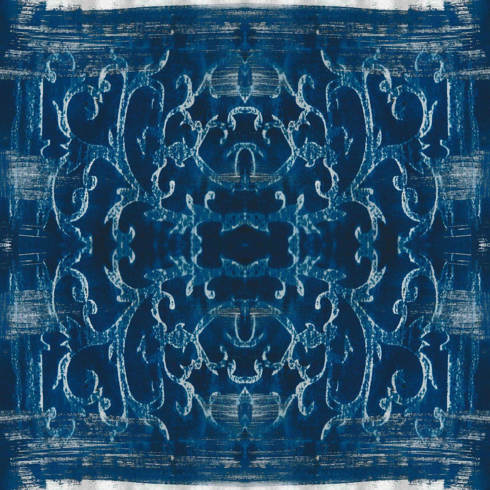 A square blanket decorated with an inky blue design