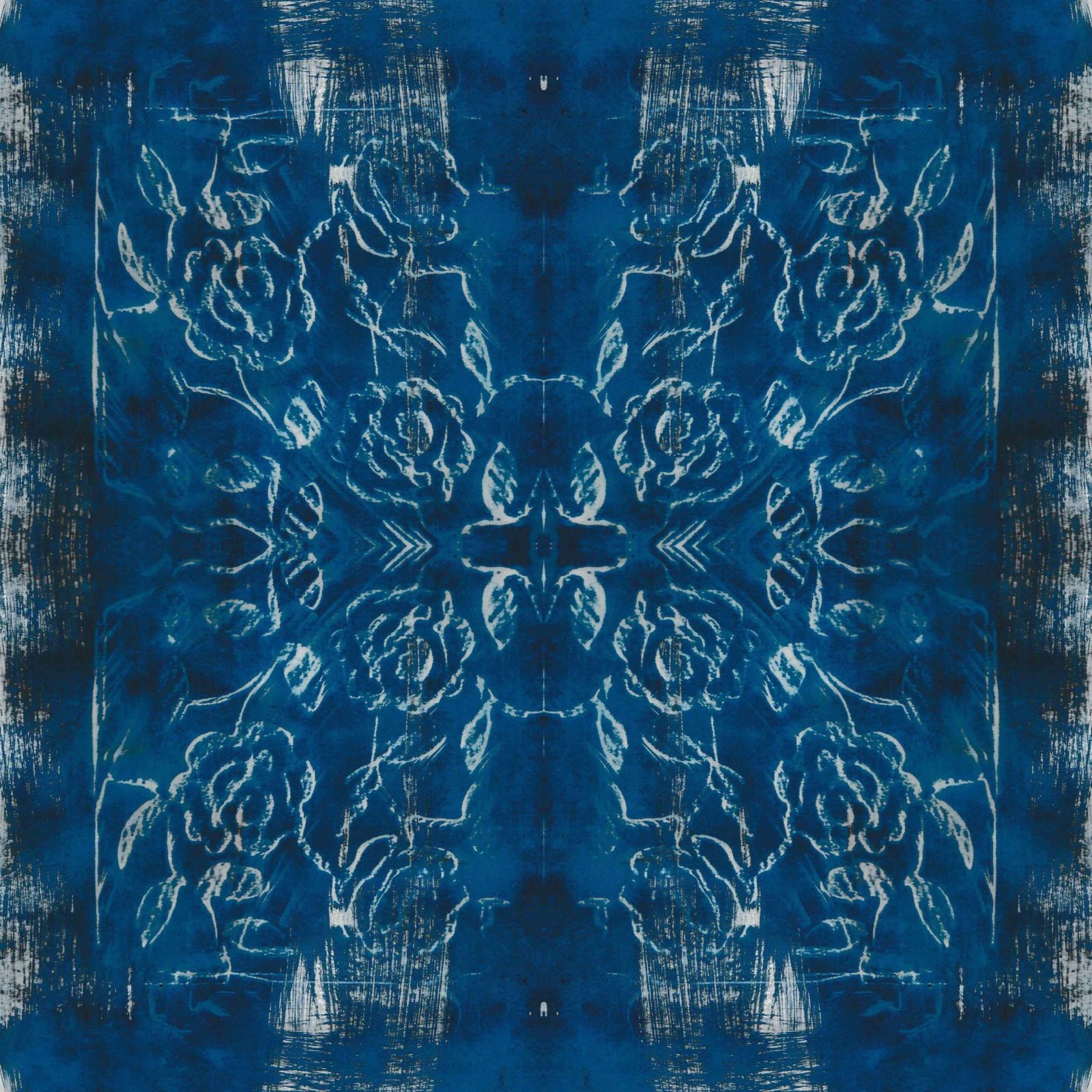 A square blanket decorated with an inky blue design