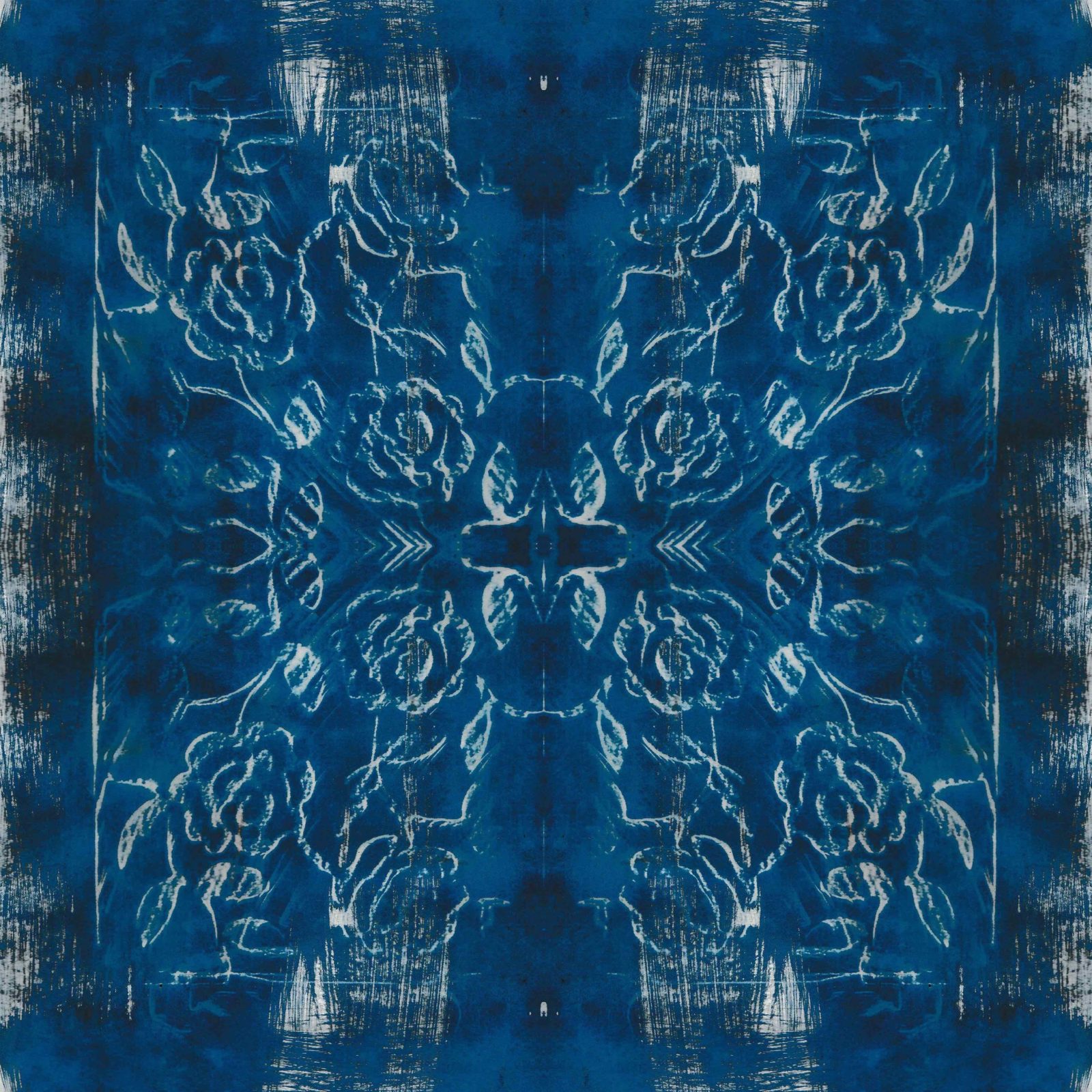 A square blanket decorated with an inky blue design