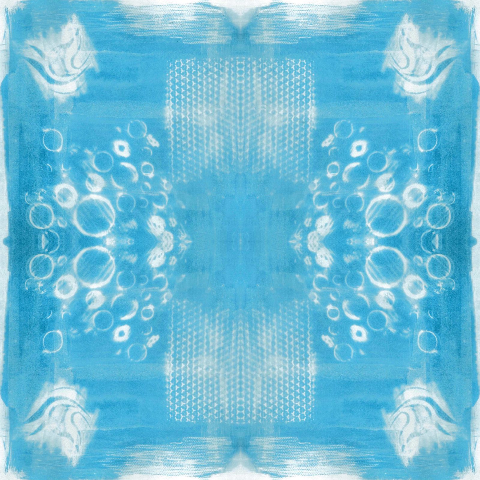 A square blanket decorated with an inky blue design