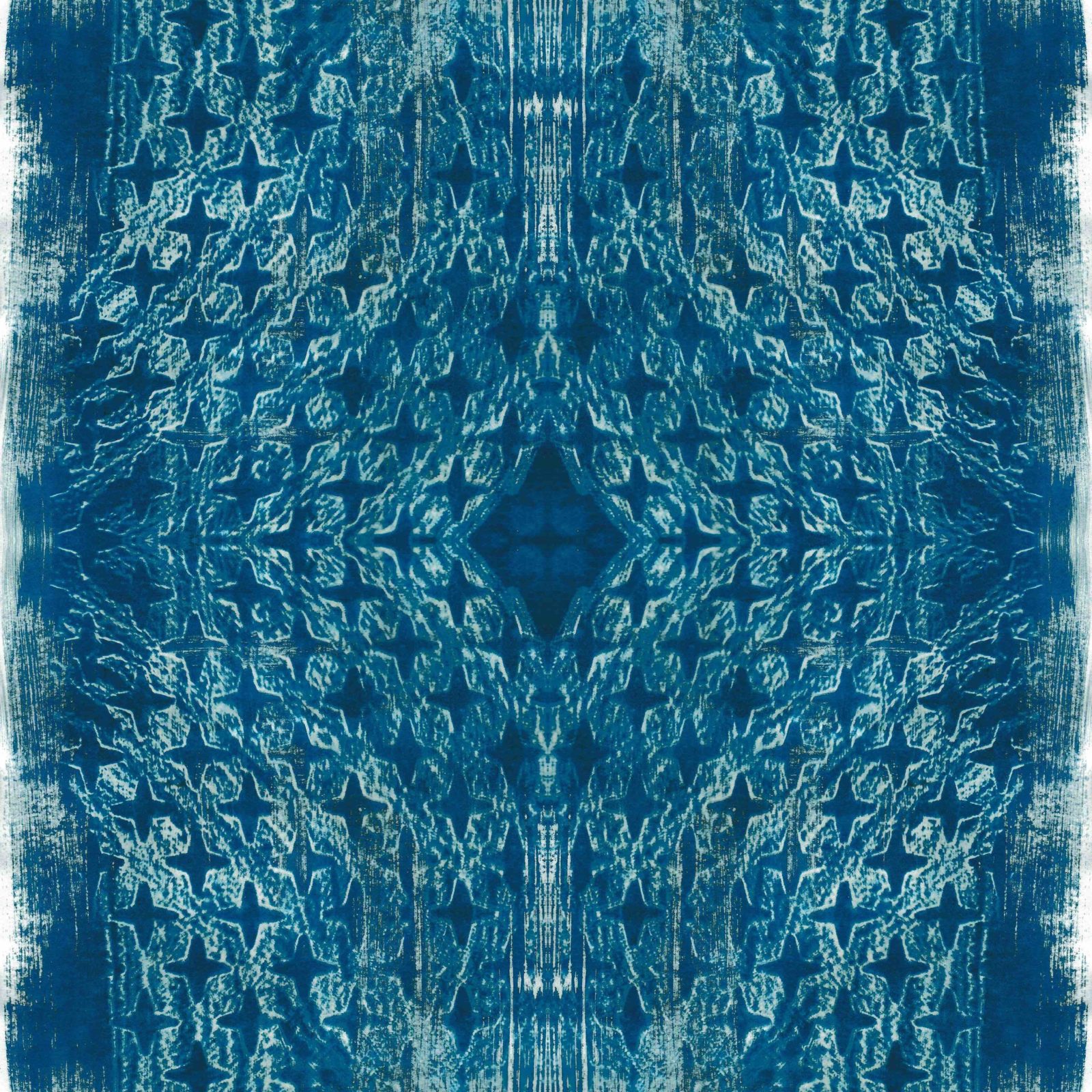 A square blanket decorated with an inky blue design