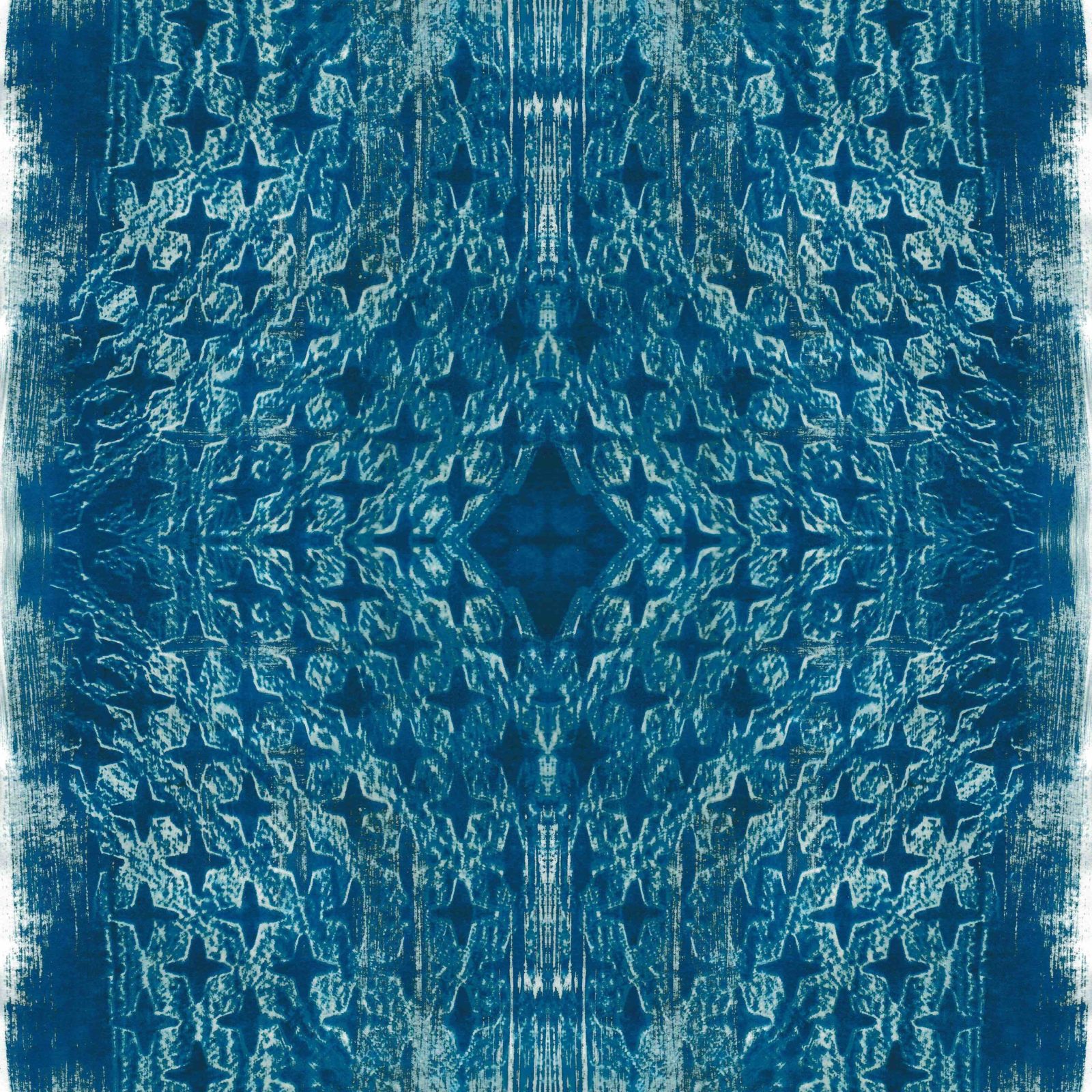 A square blanket decorated with an inky blue design