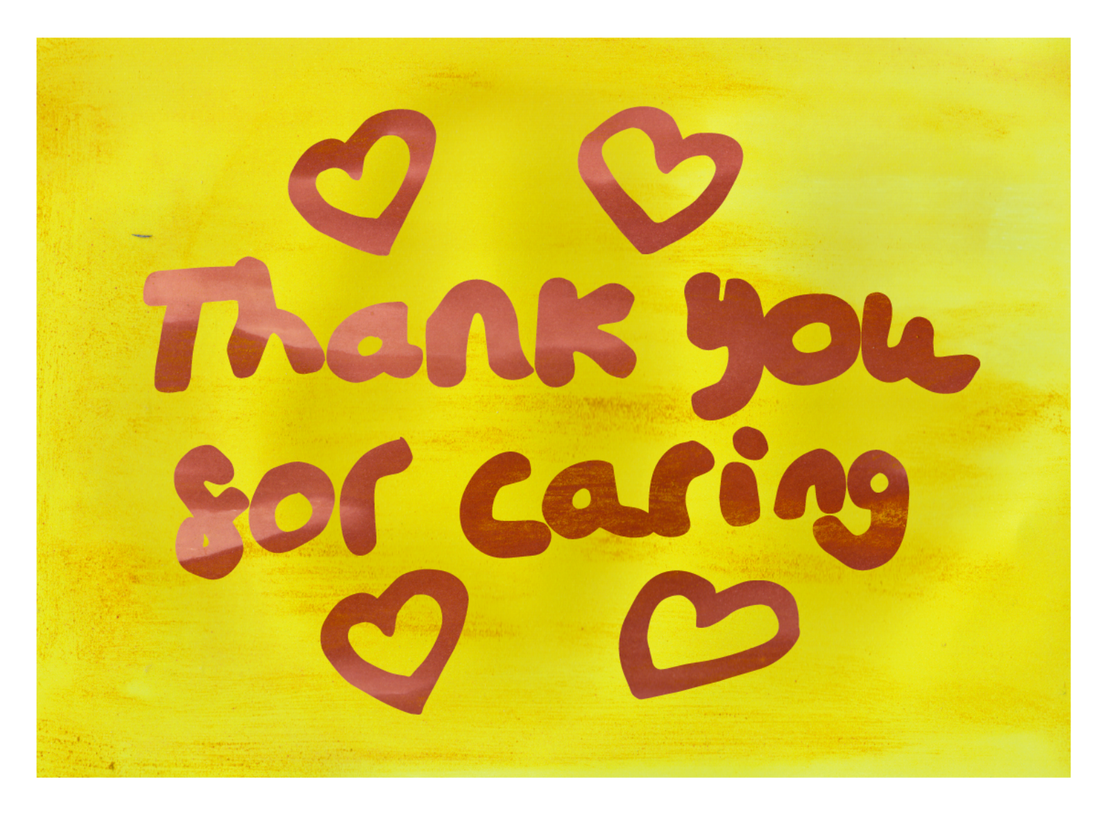 'Thank you for caring' and heart shapes in red writing on a yellow background.