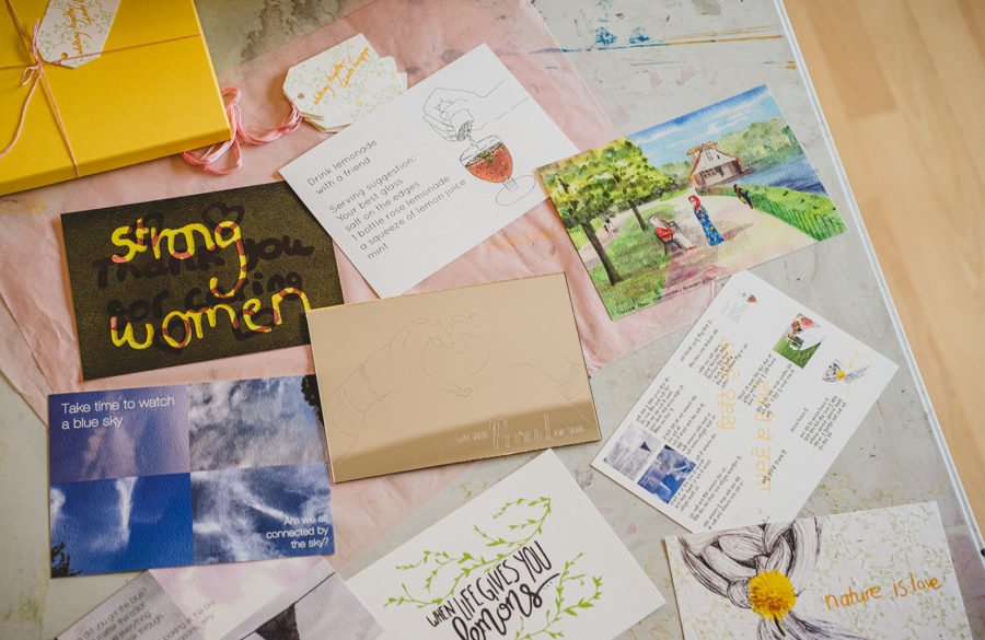 A collection of images and postcards on a table.