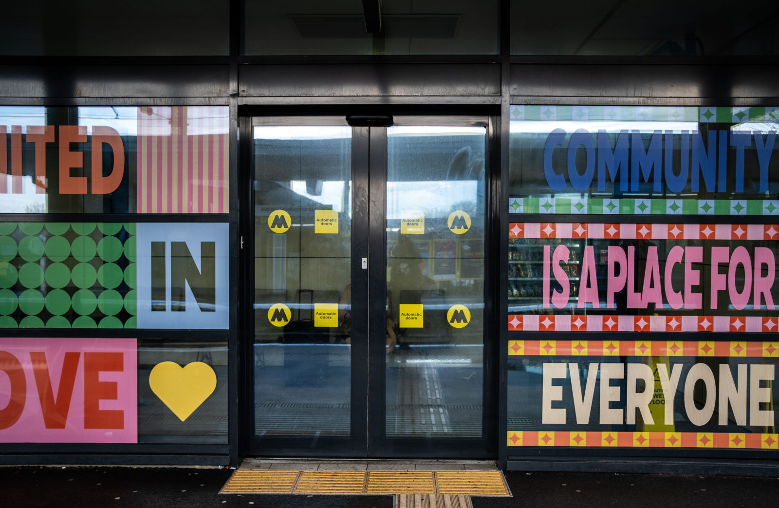 The mural is photographed front on, from this angle you can read the words ‘Community is a place for everyone’.