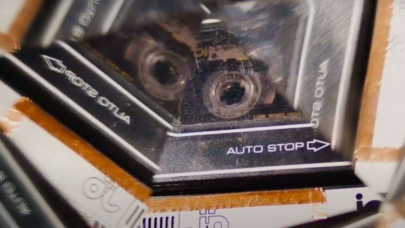 A refracted image of a cassette tape in a player