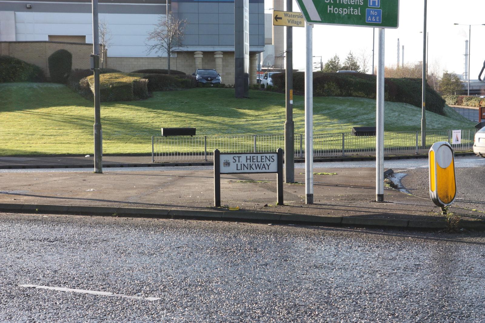 St Helens Linkway sign is on a pavement in between crossroads.