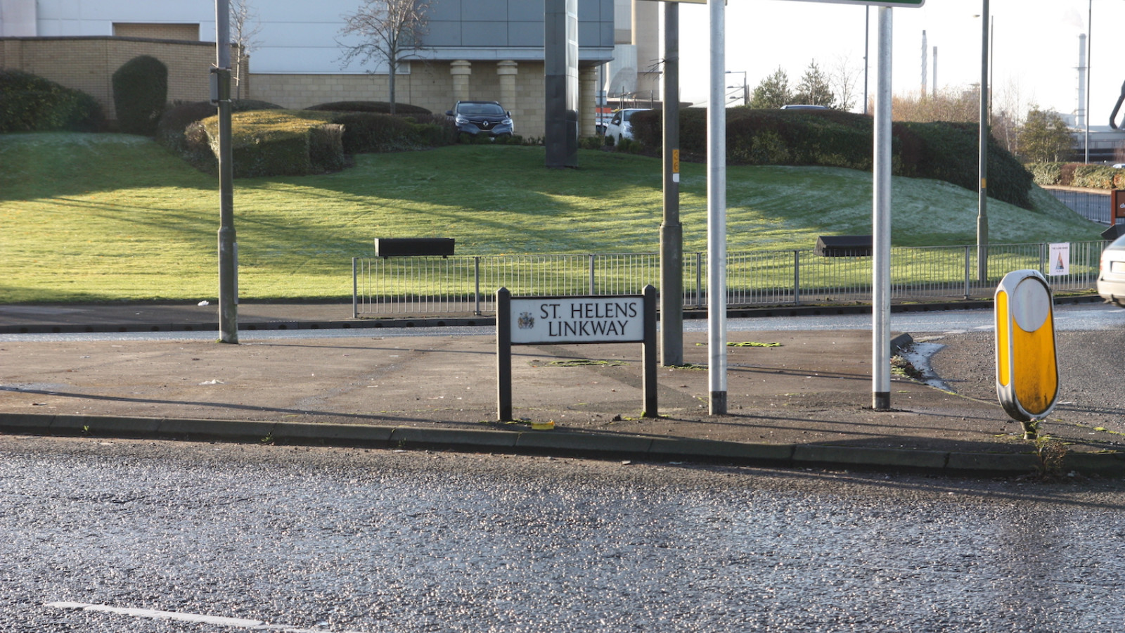 St Helens Linkway sign is on a pavement in between crossroads.