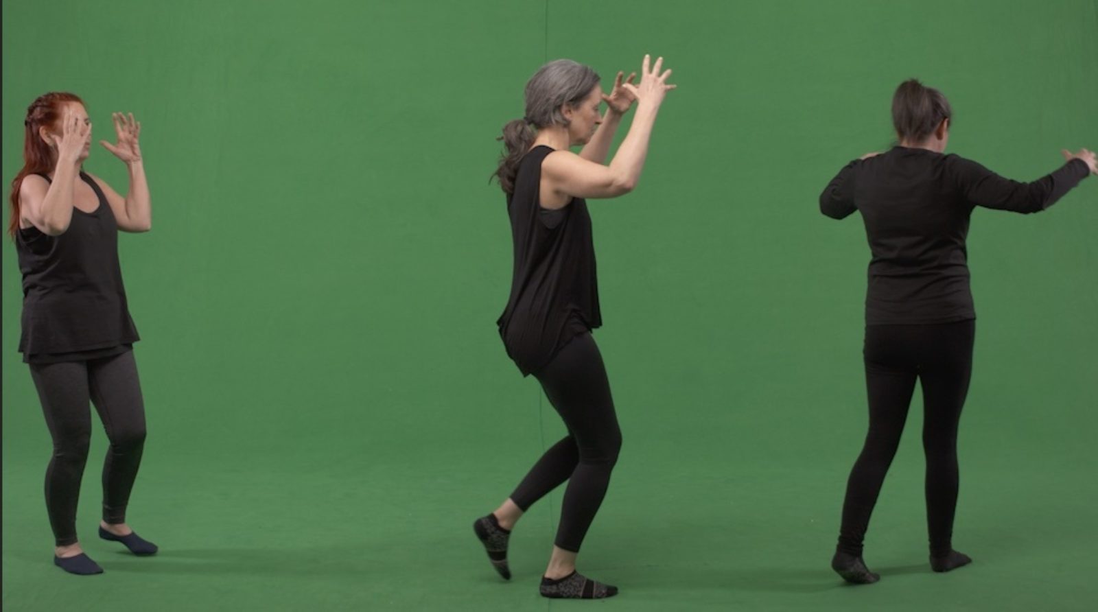 3 Women dressed in all black dancing in front of a green screen.