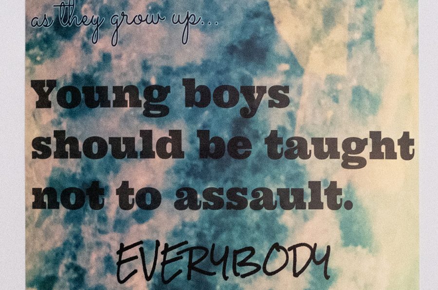Text based artwork with the words: "Young girls shouldn't be taught to look over their shoulder as they grow up... young boys should be taught not to assault. Everybody should be taught consent