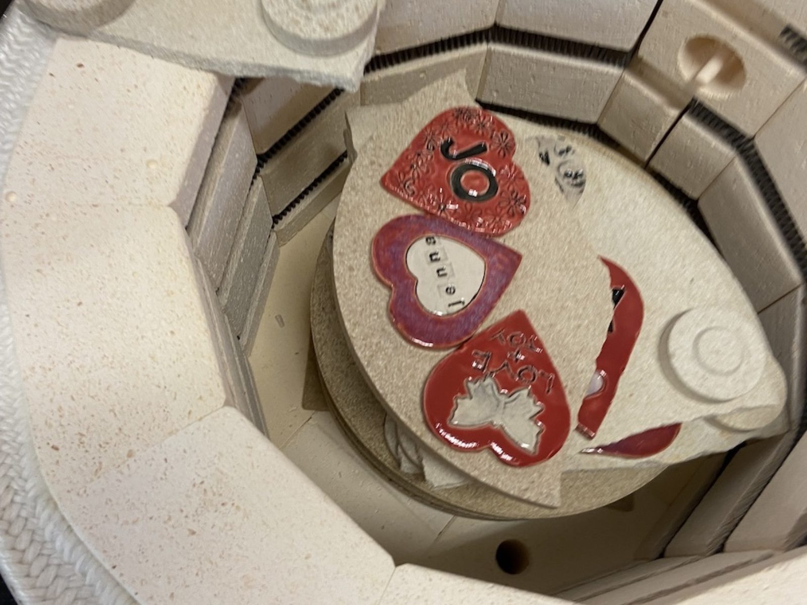 Clay hearts go into the kiln