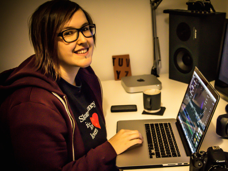 Lisa sitting at her desk in front of her computer