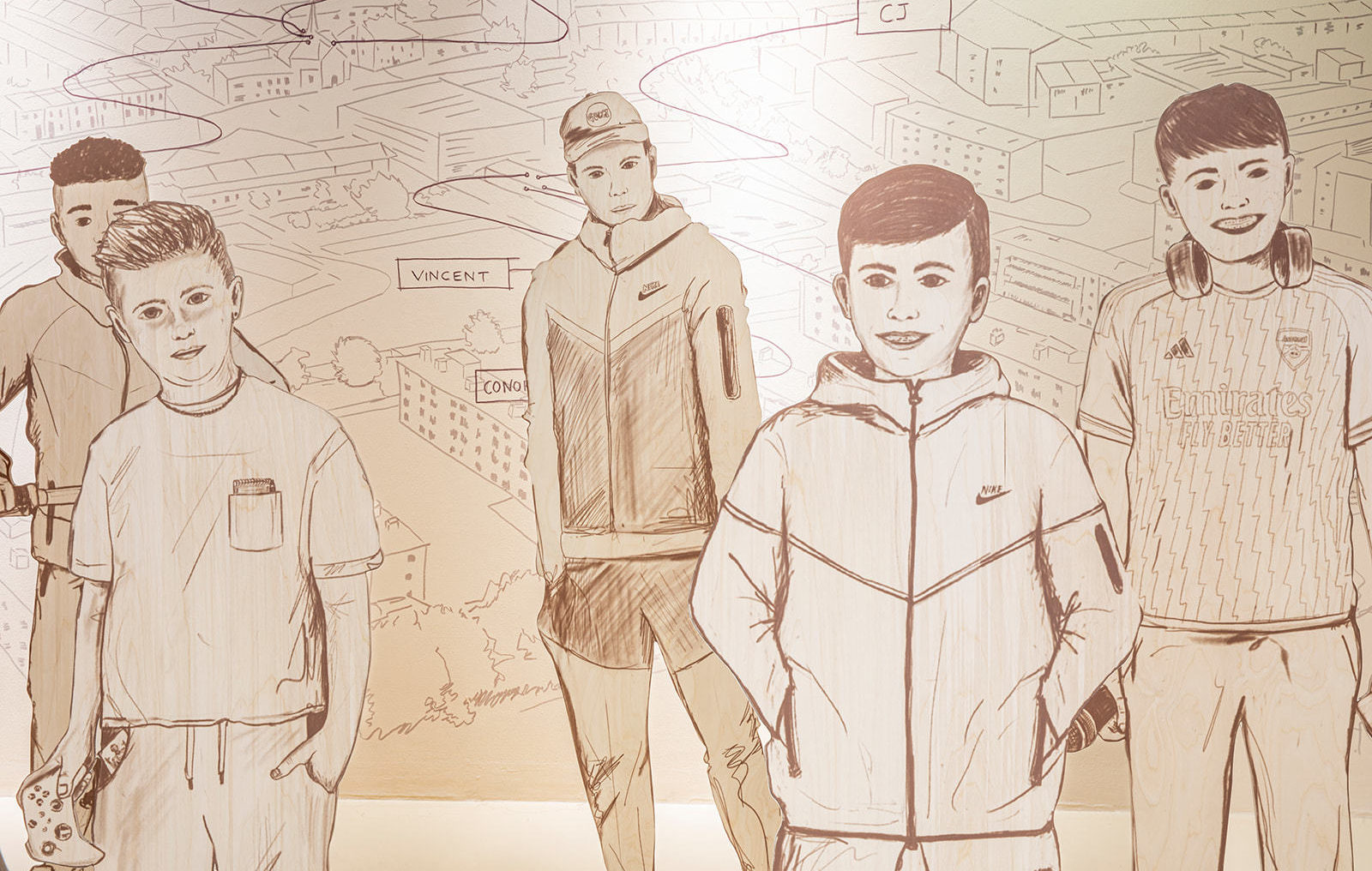 Illustrations of teenage boys printed as large cut outs and arranged in a 3D display with a hand drawn illustrated back drop of the same style.