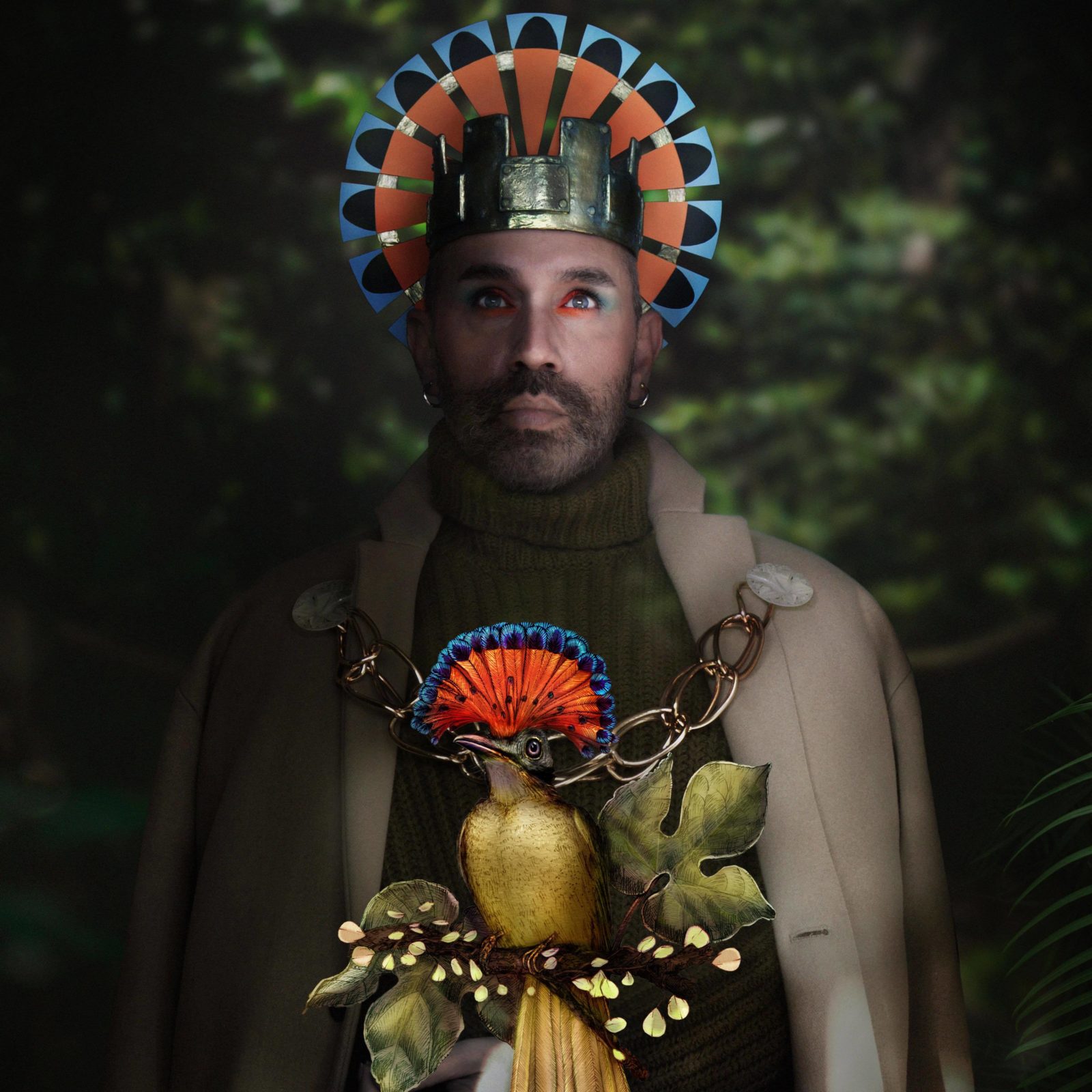 Paul Harfleet dressed as an Amazonian Royal Flycatcher, he is wearing a red and turquoise headdress, and red and turquoise eye shadow. In front of him is a detailed illustration of the bird.