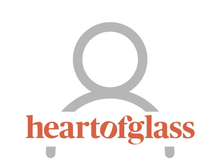 Person image placeholder, Heart of glass logo in front of clipart of anonymous person.
